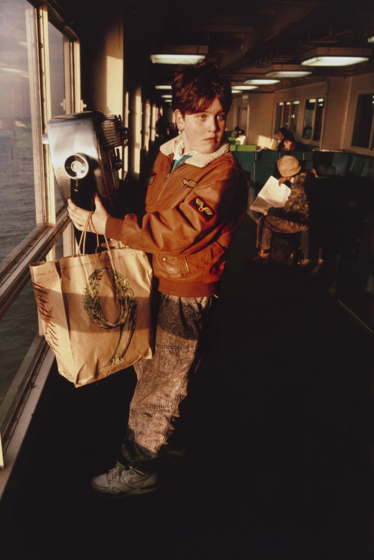 Boy looking at his mother. Staten Island Ferry. New York harbor from the series Fish Story February 1990